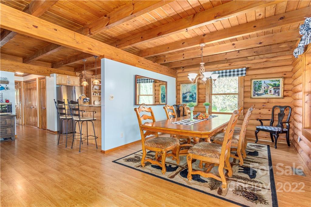 40 Yarrow Road Waynesville, NC 28785 - Photo 8 of 25 a view of a dining room with furniture a chandelier and wooden floor