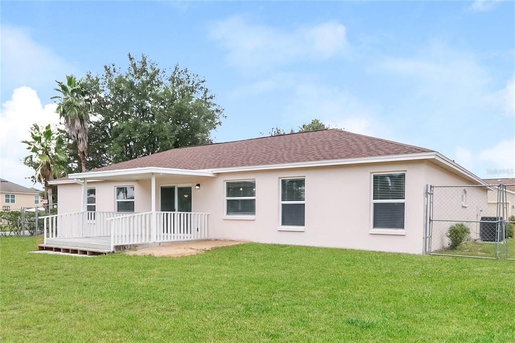 102 Ashley Loop Davenport, FL 33837 - Photo 14 of 16 a view of a house with a backyard