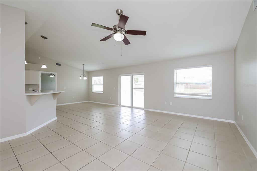 102 Ashley Loop Davenport, FL 33837 - Photo 4 of 16 a view of an empty room with a window