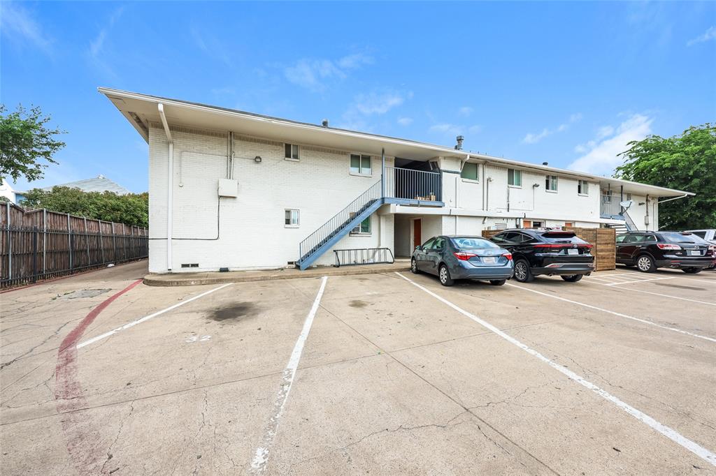 4618 Reiger Avenue, Unit 104 Dallas, TX 75246 - Photo 18 of 19 a car parked in front of garage