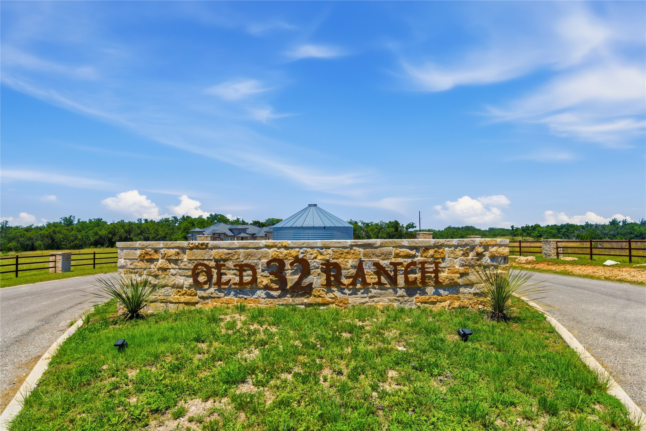623 Whiskey Trail Blanco, TX 78606 - Photo 12 of 23 A stone-clad entrance monument welcomes you to the Old 32 Ranch