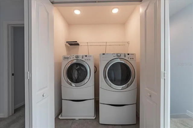 a utility room with dryer and washer