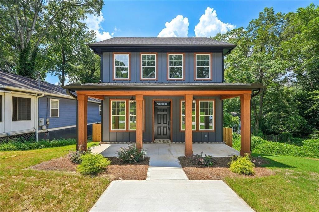 1179 Booker Avenue Southwest Atlanta, GA 30310 - Photo 1 of 54 a front view of a house with garden