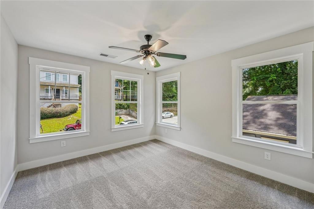 1179 Booker Avenue Southwest Atlanta, GA 30310 - Photo 40 of 54 a view of room with window and ceiling fan