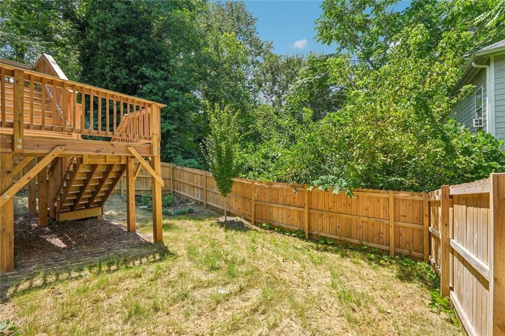 1179 Booker Avenue Southwest Atlanta, GA 30310 - Photo 47 of 54 a view of an house with backyard and trees