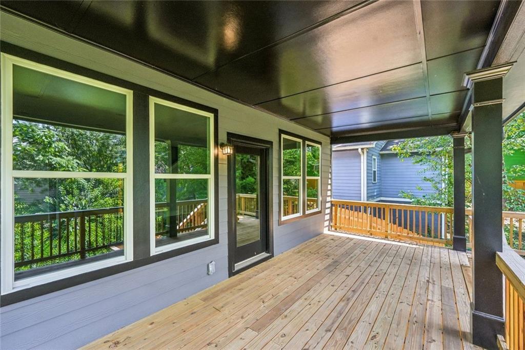 1179 Booker Avenue Southwest Atlanta, GA 30310 - Photo 51 of 54 a view of porch with wooden floor and floor to ceiling window
