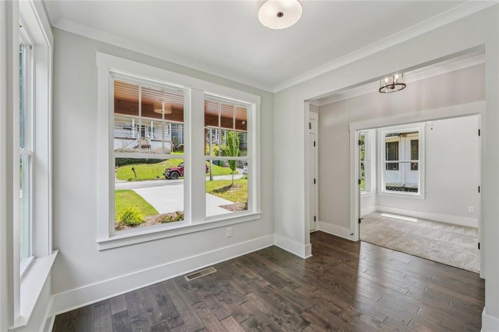 1179 Booker Avenue Southwest Atlanta, GA 30310 - Photo 6 of 54 wooden floor in an empty room with a window