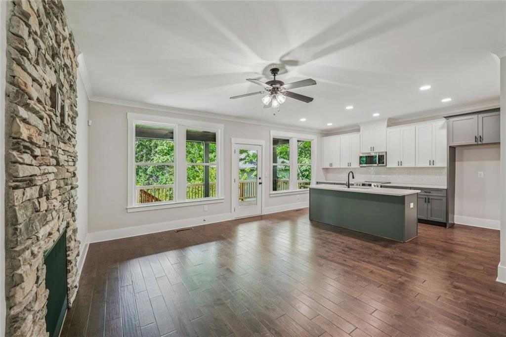 1179 Booker Avenue Southwest Atlanta, GA 30310 - Photo 7 of 54 a large kitchen with a large window a sink and a refrigerator