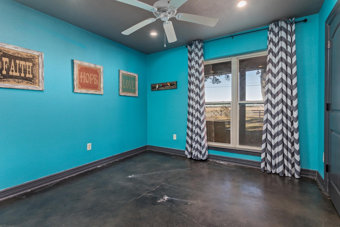 909 Turner Road Beaumont, TX 77713 - Photo 22 of 43 a view of empty room with window and ceiling fan