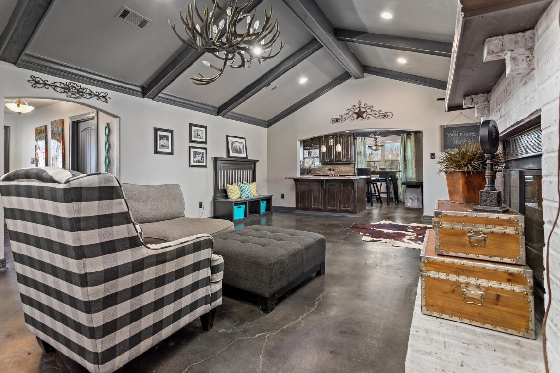 909 Turner Road Beaumont, TX 77713 - Photo 7 of 43 a living room with furniture and a chandelier