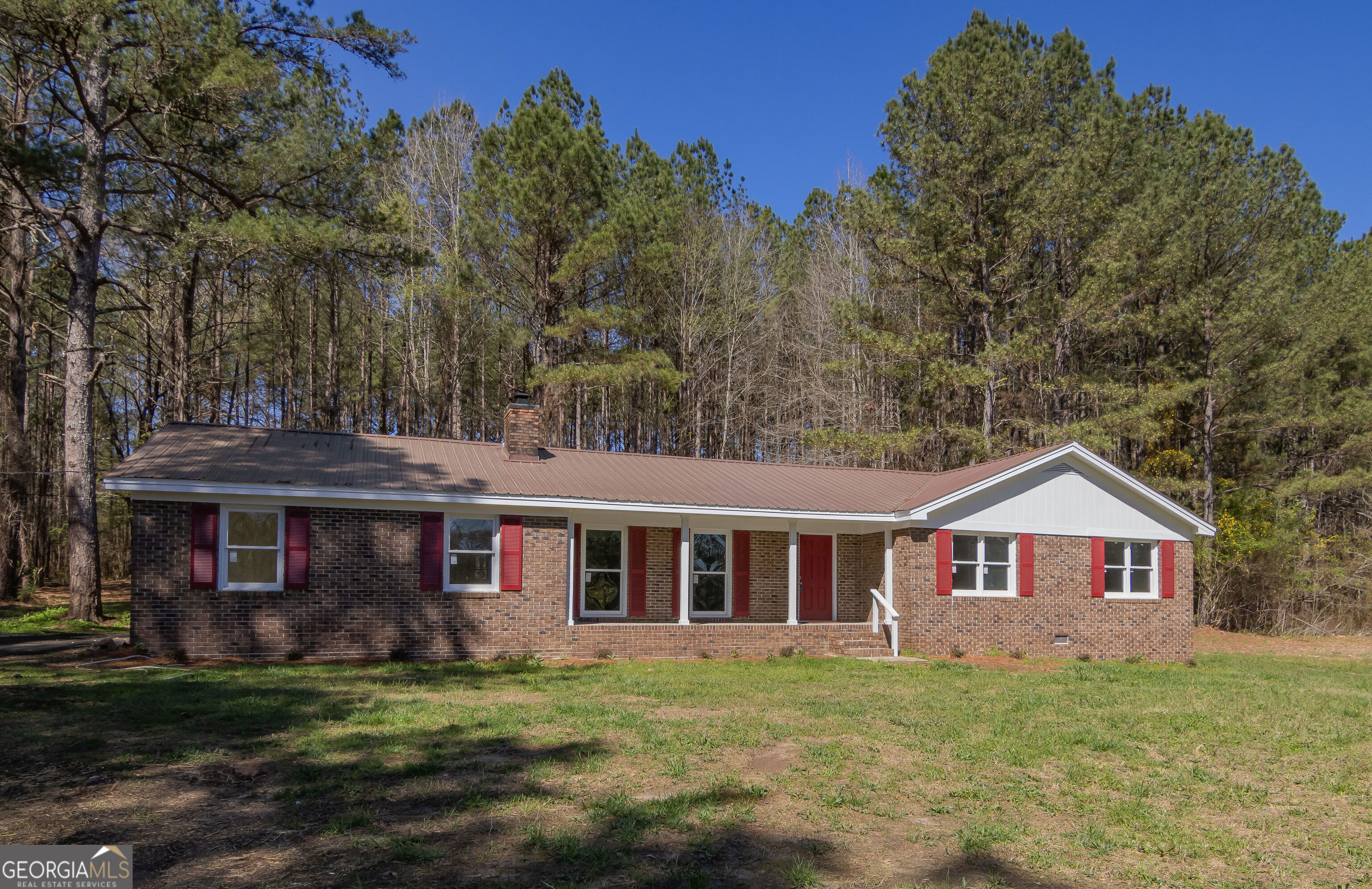 331 Deerfield Road Hogansville, GA 30230 - Photo 1 of 62 a front view of a house with a garden