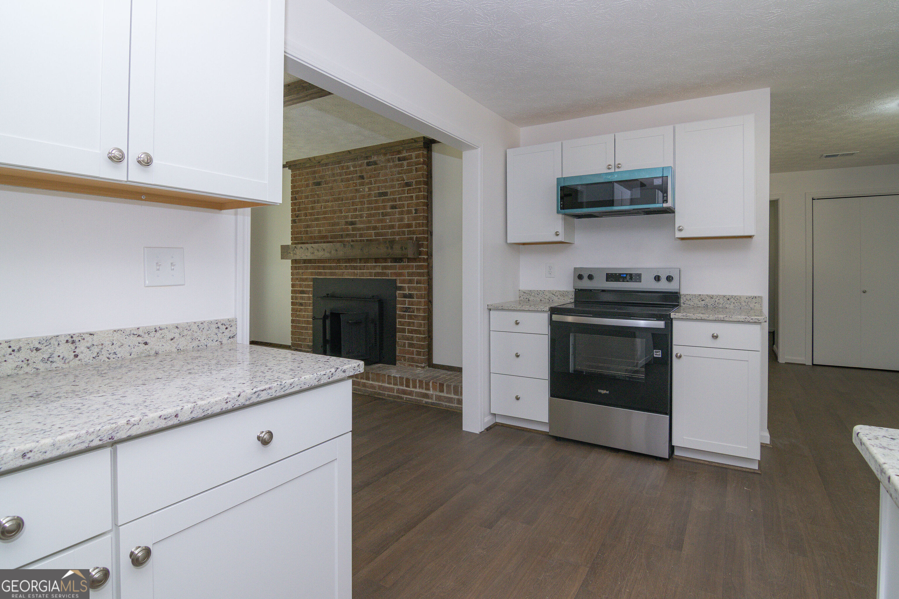 331 Deerfield Road Hogansville, GA 30230 - Photo 17 of 62 a kitchen with stainless steel appliances white cabinets and a sink