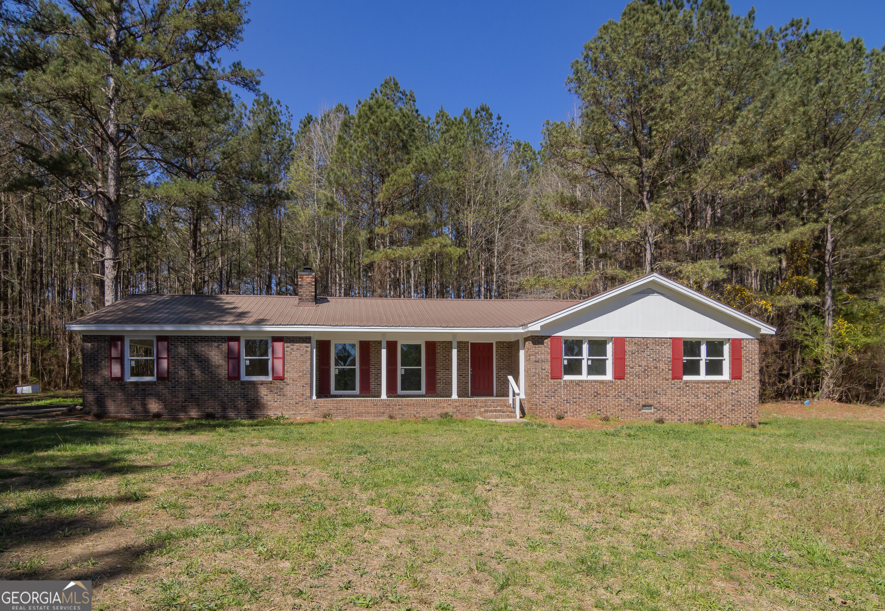 331 Deerfield Road Hogansville, GA 30230 - Photo 2 of 62 a view of a yard in front of house