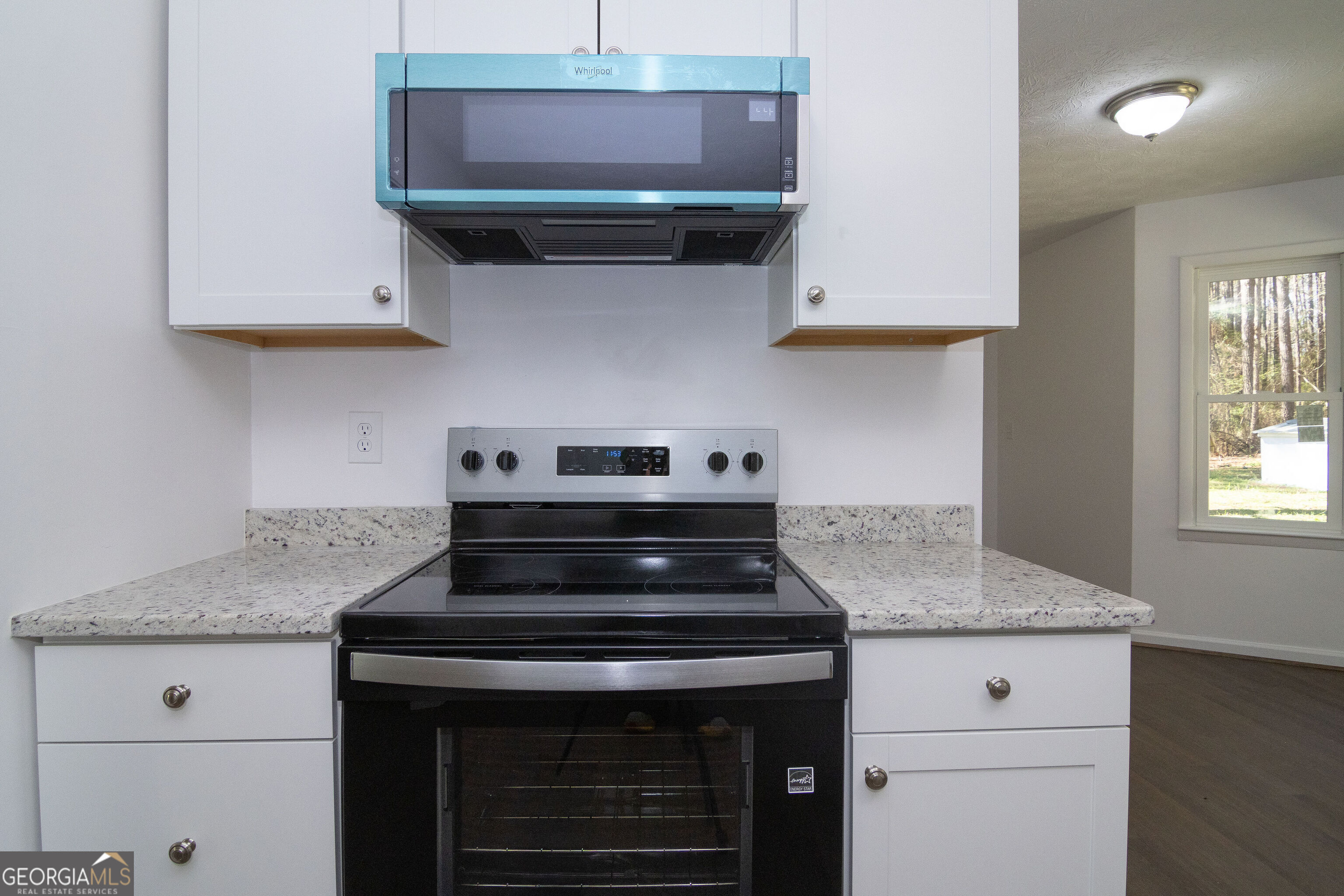 331 Deerfield Road Hogansville, GA 30230 - Photo 21 of 62 a kitchen with stainless steel appliances granite countertop a stove and a sink