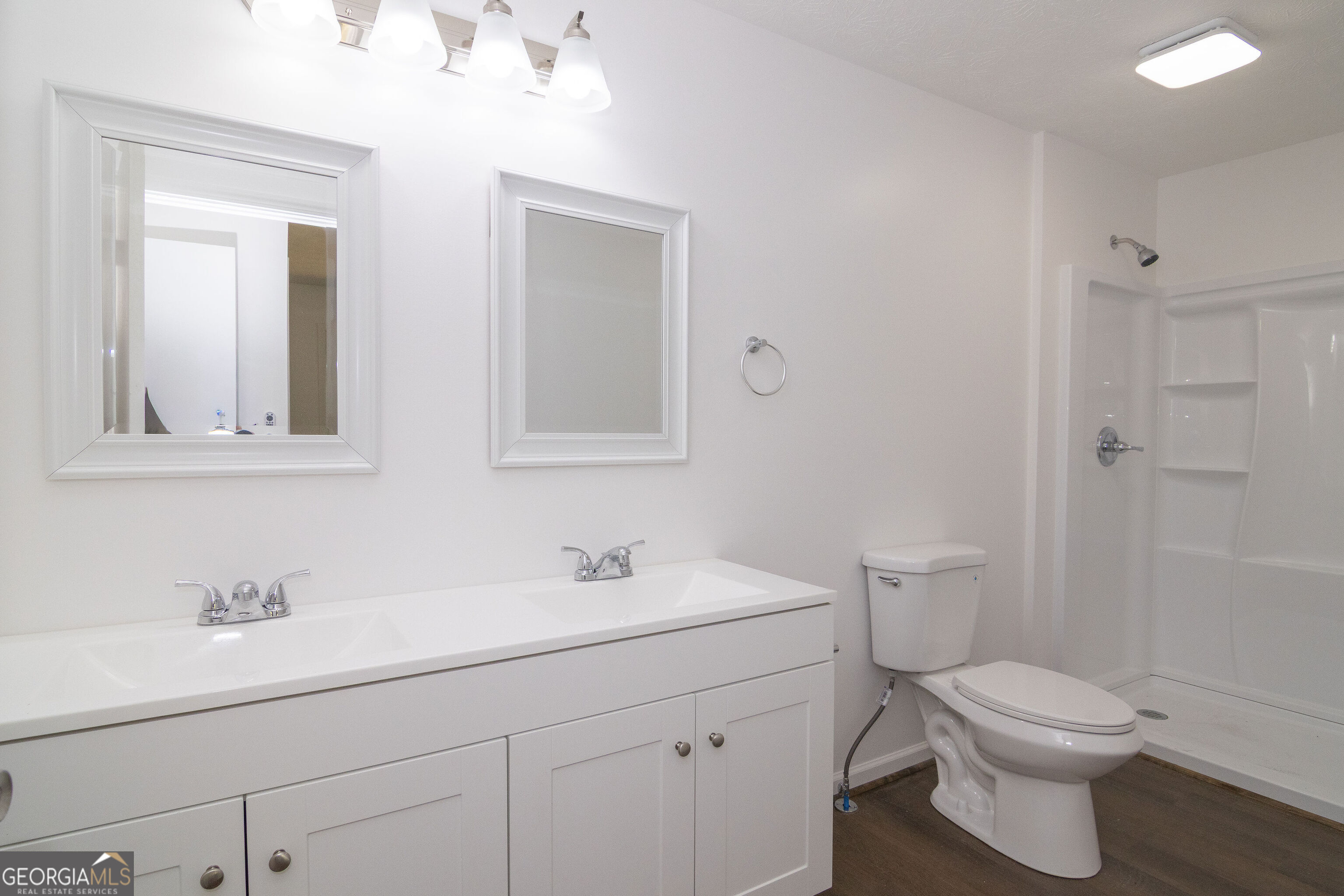 331 Deerfield Road Hogansville, GA 30230 - Photo 41 of 62 a bathroom with a toilet sink and mirror