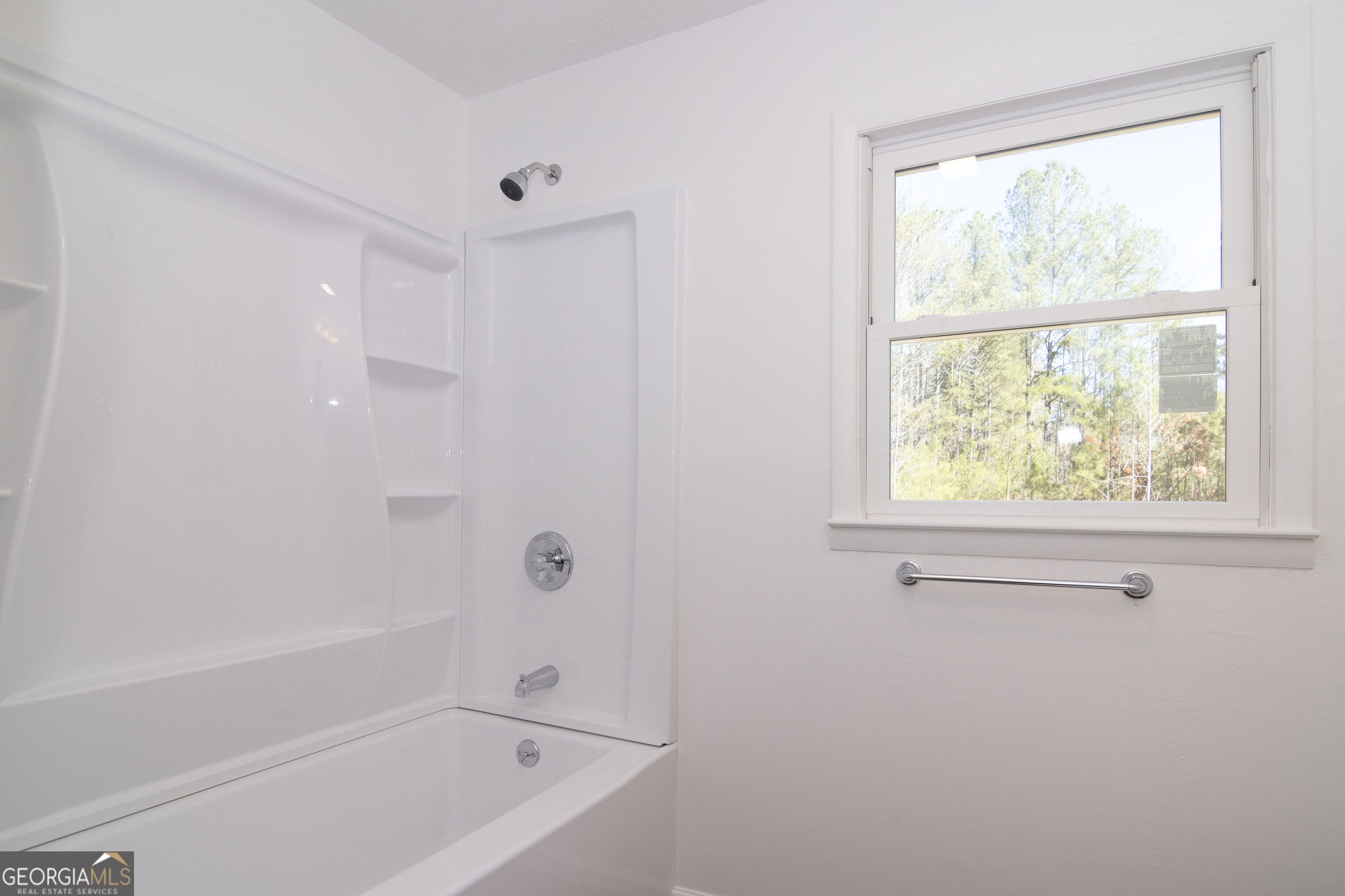 331 Deerfield Road Hogansville, GA 30230 - Photo 45 of 62 a white bath tub sitting next to a window