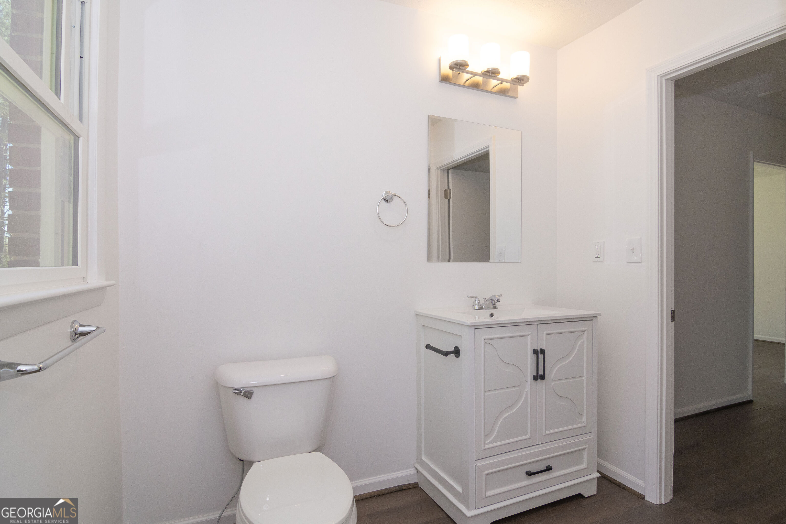 331 Deerfield Road Hogansville, GA 30230 - Photo 46 of 62 a bathroom with a sink a toilet and mirror