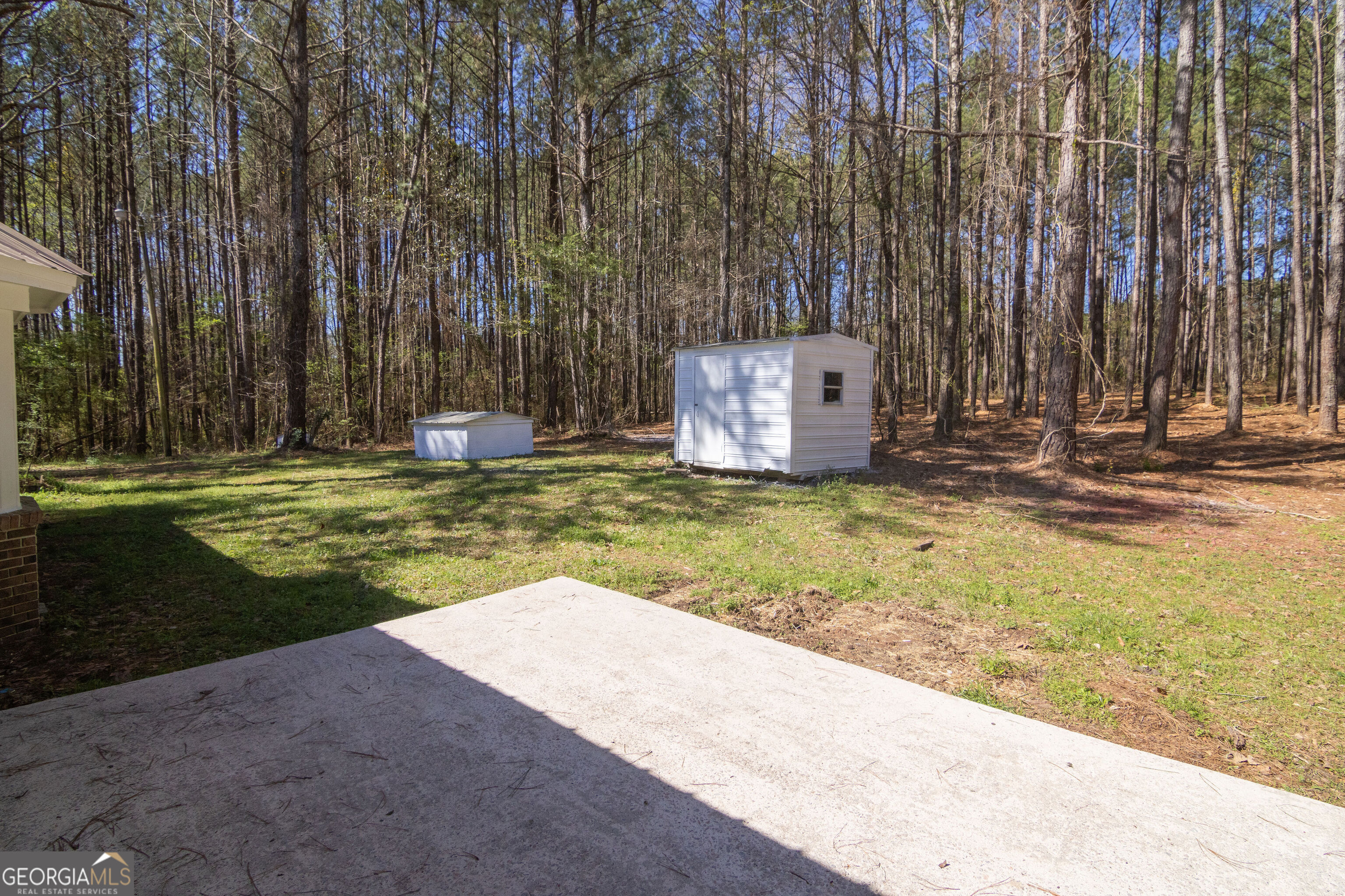 331 Deerfield Road Hogansville, GA 30230 - Photo 51 of 62 a view of a swimming pool with a big yard and large trees