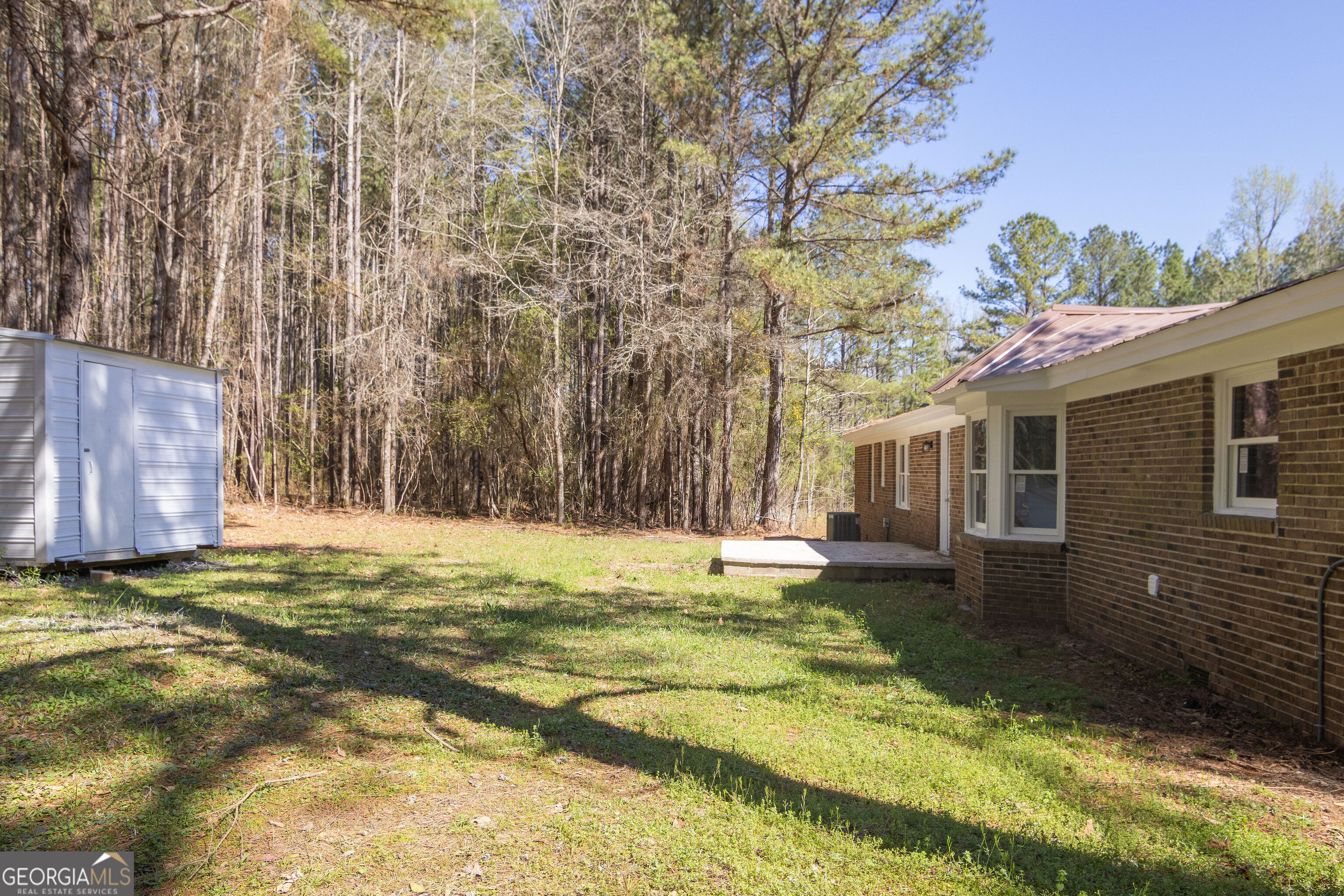 331 Deerfield Road Hogansville, GA 30230 - Photo 60 of 62 a swimming pool with trees in the background