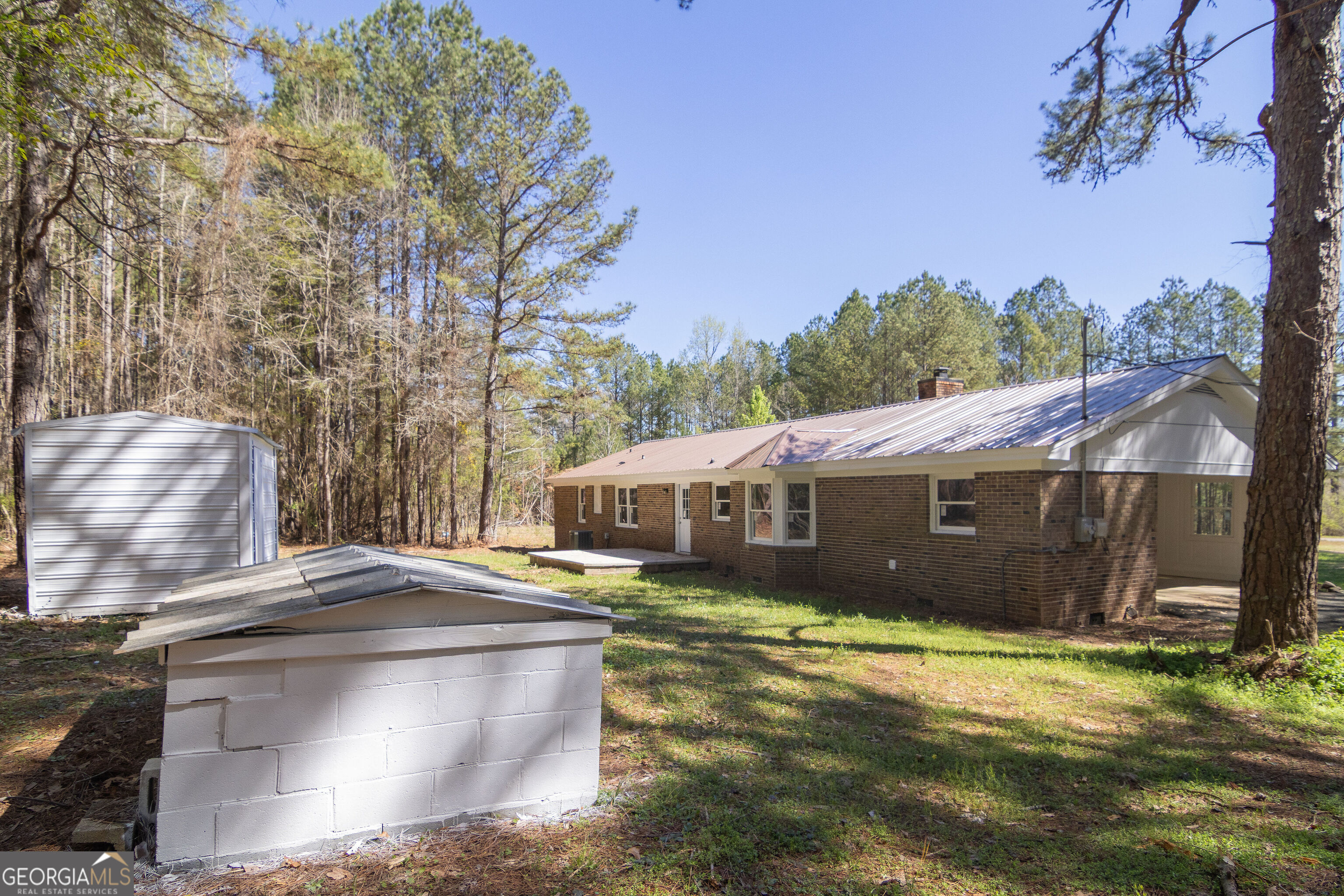 331 Deerfield Road Hogansville, GA 30230 - Photo 62 of 62 a view of a house with a yard and sitting area