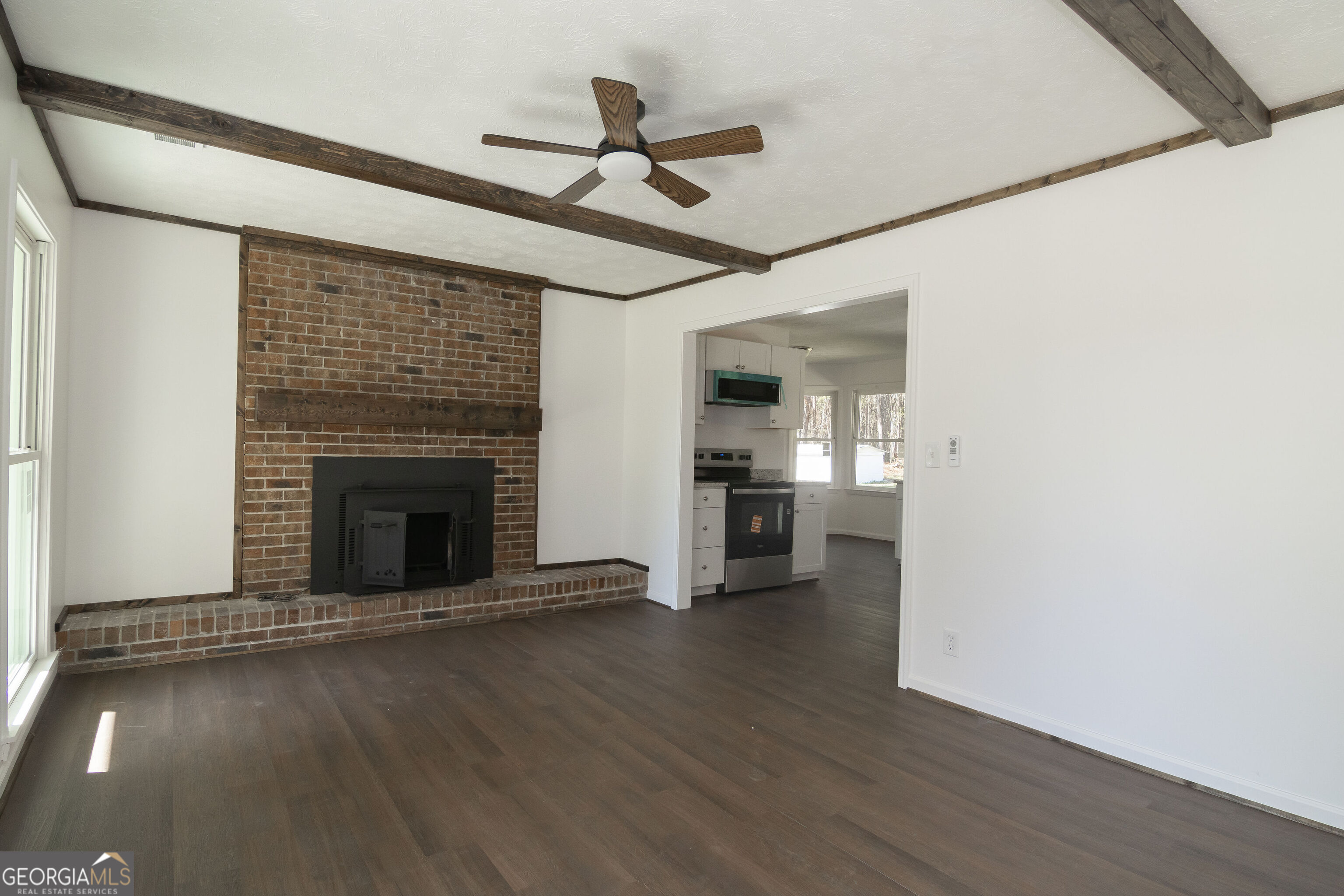 331 Deerfield Road Hogansville, GA 30230 - Photo 10 of 62 a view of empty room with wooden floor and a ceiling fan