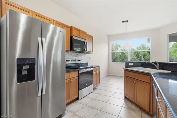 a view of a kitchen with a sink