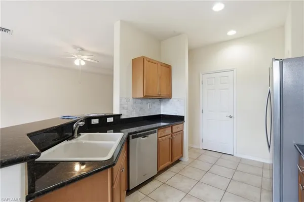 a kitchen with a stove and a microwave