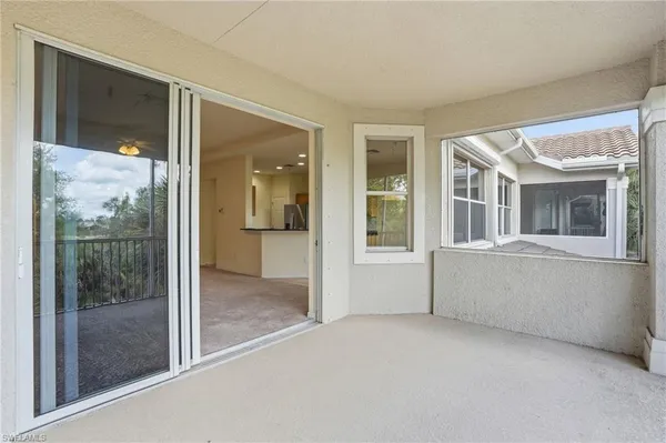 a view of an empty room with glass door