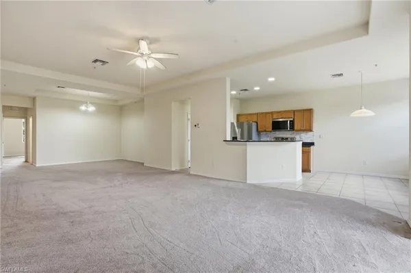 a view of a kitchen with a sink and a stove top oven