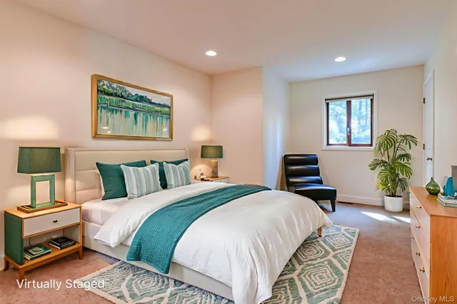 a spacious bedroom with a bed and a couch