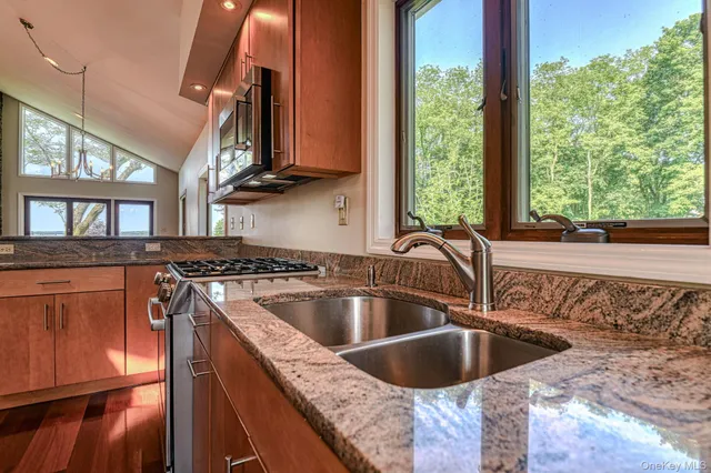 a stove top oven sitting inside of a kitchen