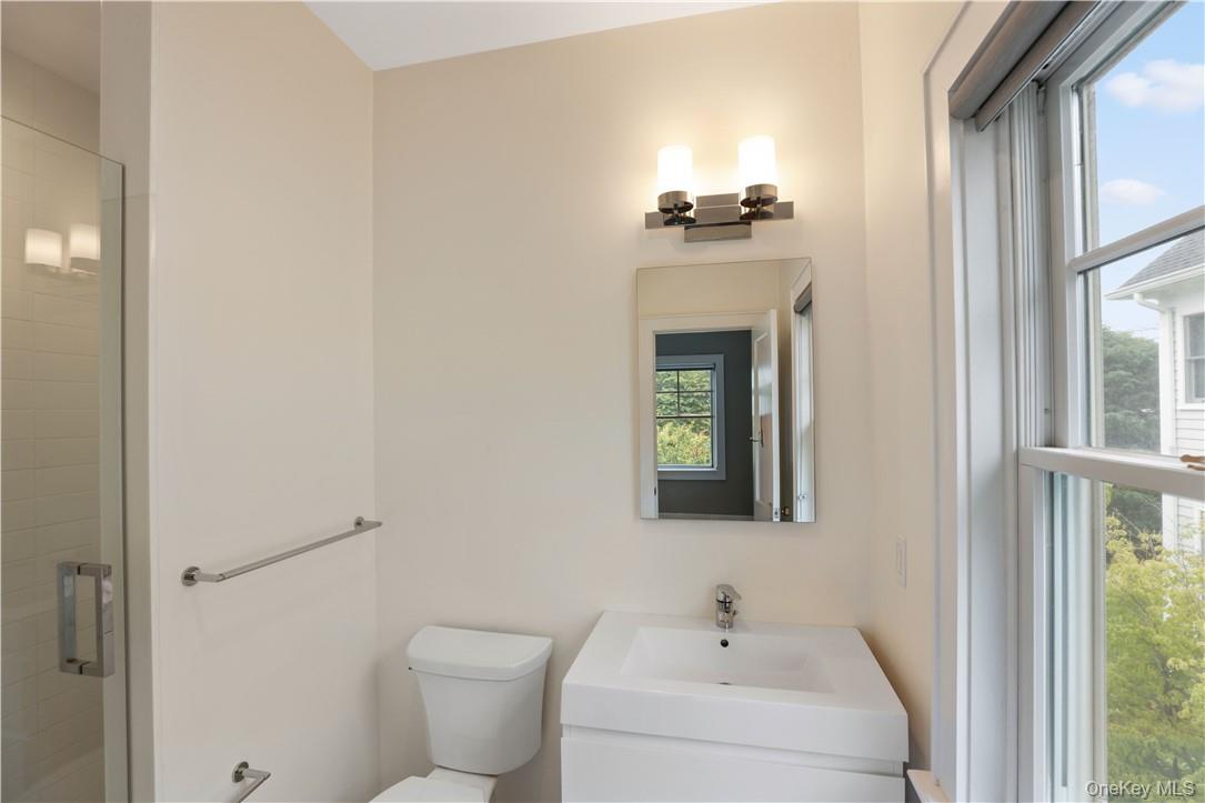 113 Brown Road Scarsdale, NY 10583 - Photo 14 of 27 a bathroom with a toilet and a sink