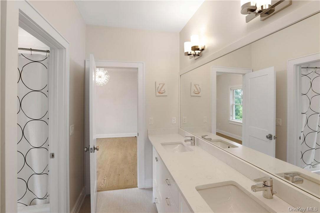 113 Brown Road Scarsdale, NY 10583 - Photo 17 of 27 a bathroom with a sink and a mirror