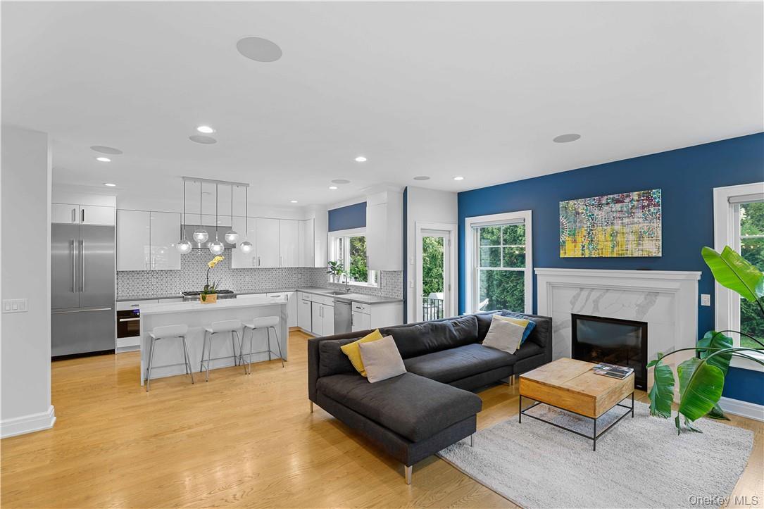 113 Brown Road Scarsdale, NY 10583 - Photo 2 of 27 a living room with furniture and a fireplace