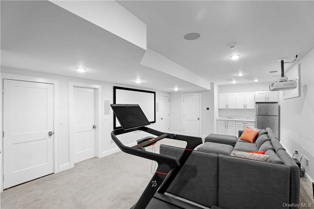 113 Brown Road Scarsdale, NY 10583 - Photo 21 of 27 a room with furniture and a flat screen tv