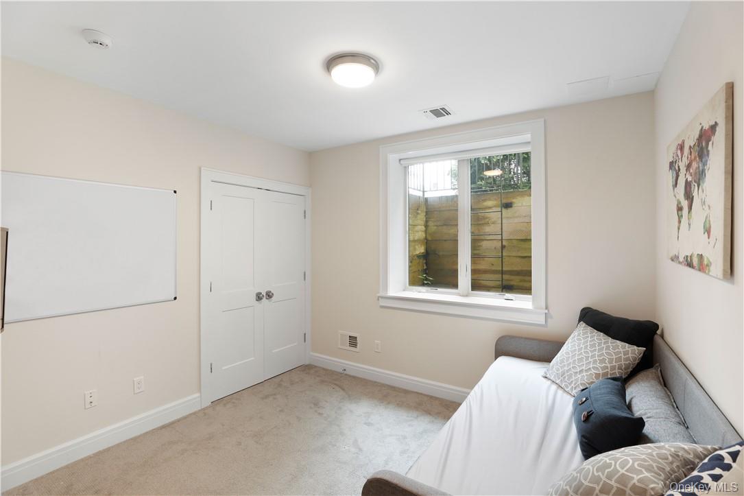 113 Brown Road Scarsdale, NY 10583 - Photo 22 of 27 a bedroom with a bed and a window