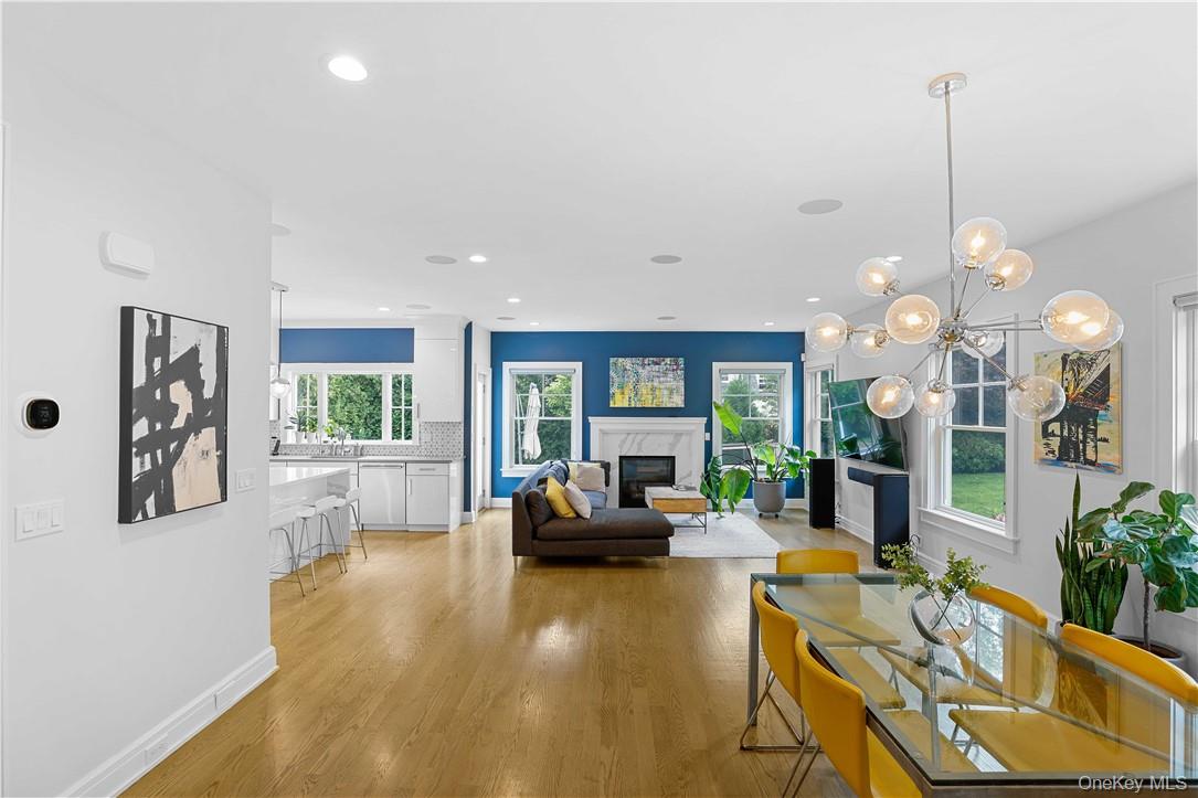 113 Brown Road Scarsdale, NY 10583 - Photo 8 of 27 a living room with furniture a chandelier and a large mirror