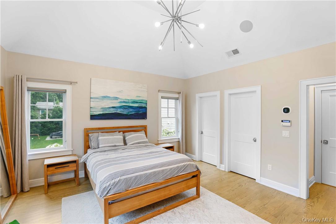 113 Brown Road Scarsdale, NY 10583 - Photo 9 of 27 a bedroom with a large bed and a window