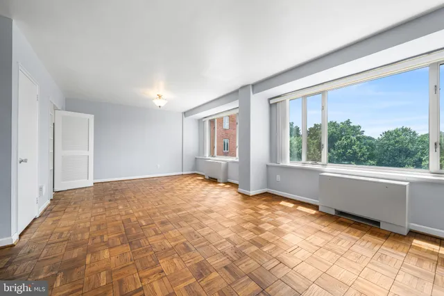 a view of an empty room with a window