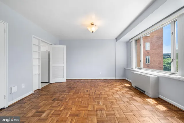 a view of an empty room with a window