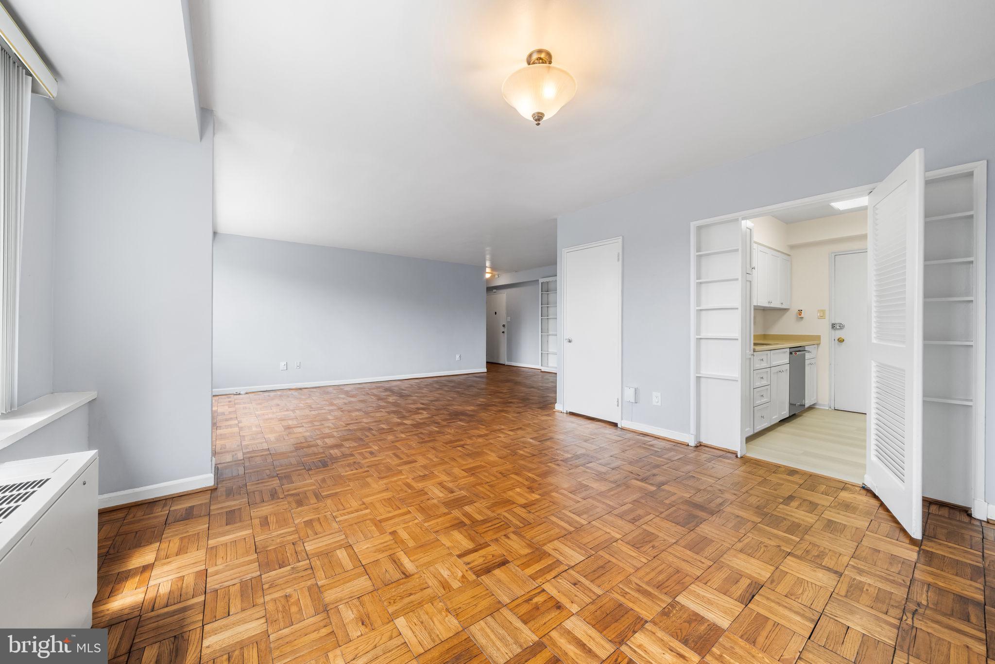 4301 Massachusetts Avenue Northwest, Unit 6006 Washington, DC 20016 - Photo 21 of 33 a view of empty room with wooden floor