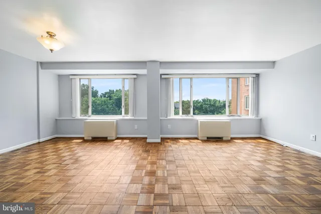 a view of an empty room with a window