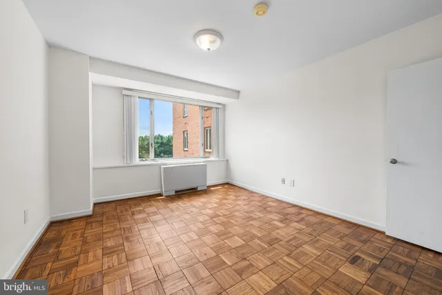 a view of an empty room with a window