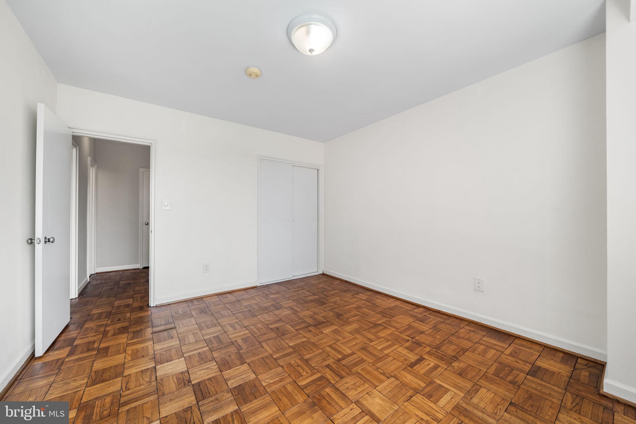 4301 Massachusetts Avenue Northwest, Unit 6006 Washington, DC 20016 - Photo 7 of 33 wooden floor in an empty room