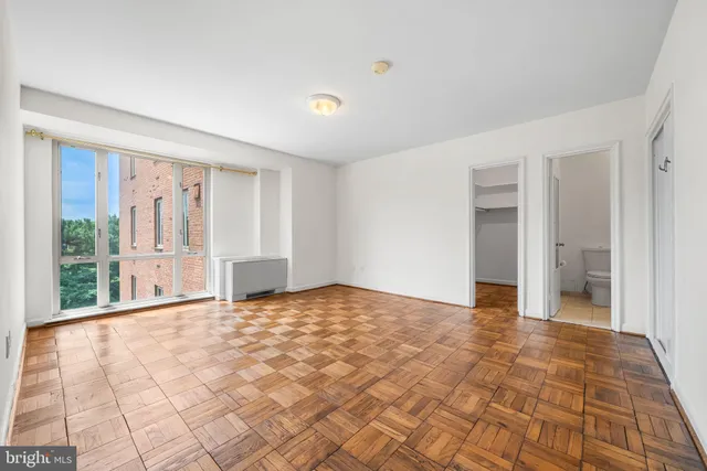 a view of an empty room with a window