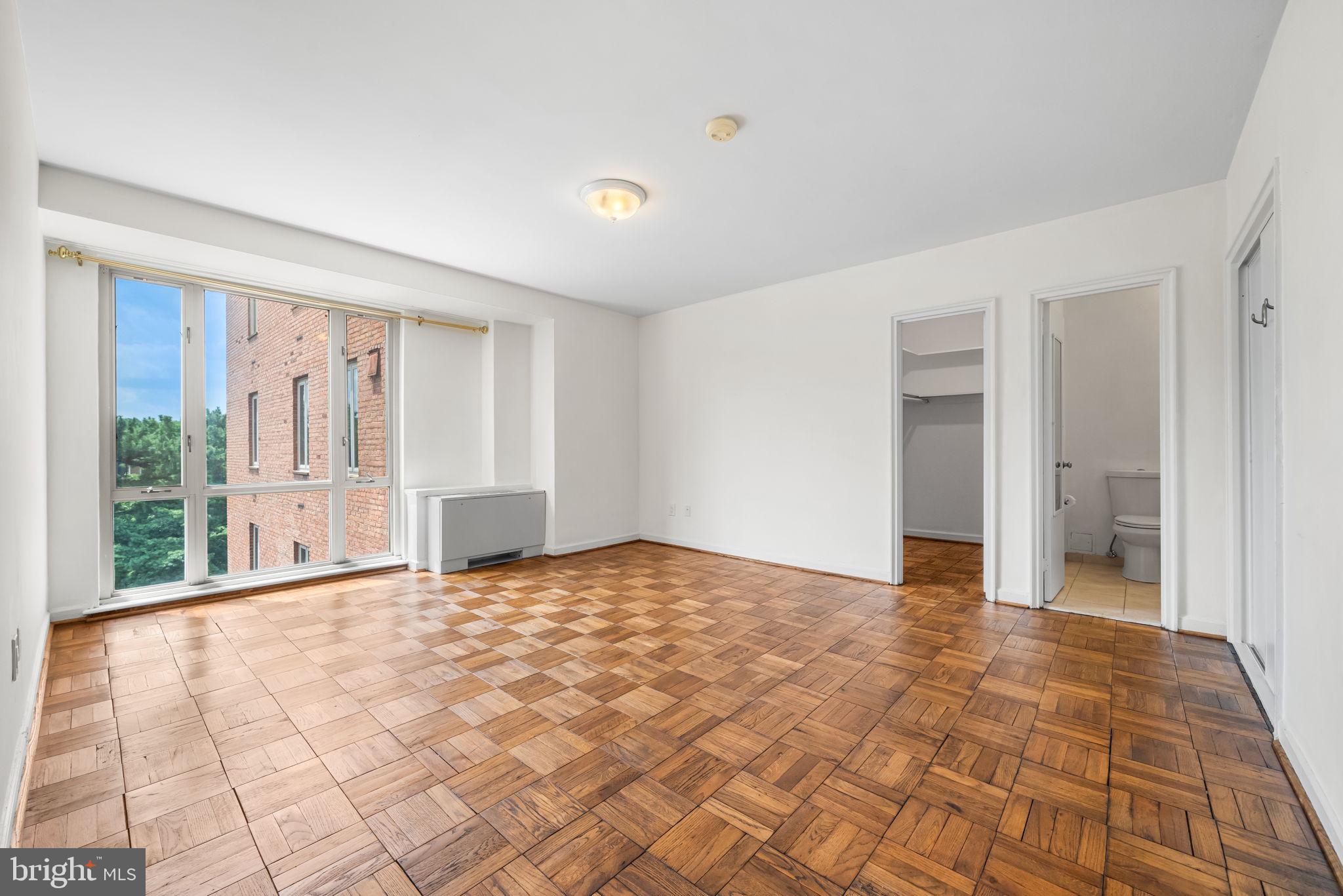 4301 Massachusetts Avenue Northwest, Unit 6006 Washington, DC 20016 - Photo 8 of 33 a view of an empty room with a window
