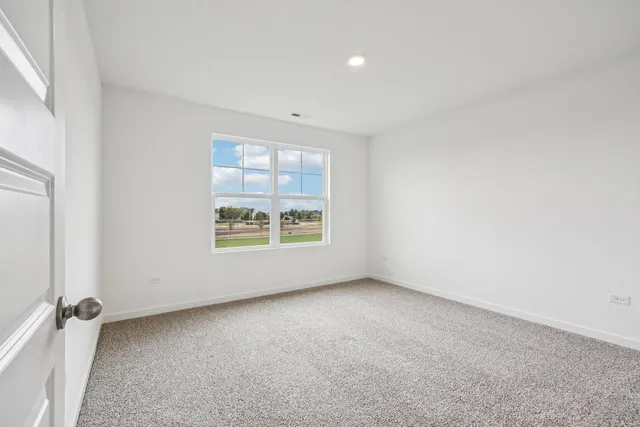 an empty room with closet area
