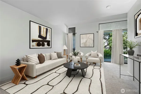 a living room with furniture a couch and paintings on the wall