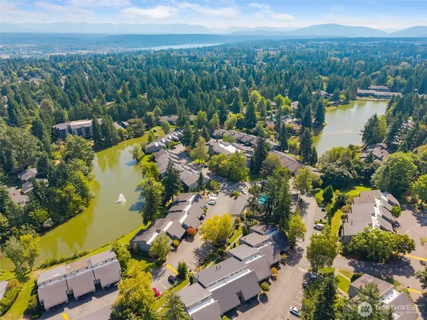 an aerial view of residential house with outdoor space and lake view