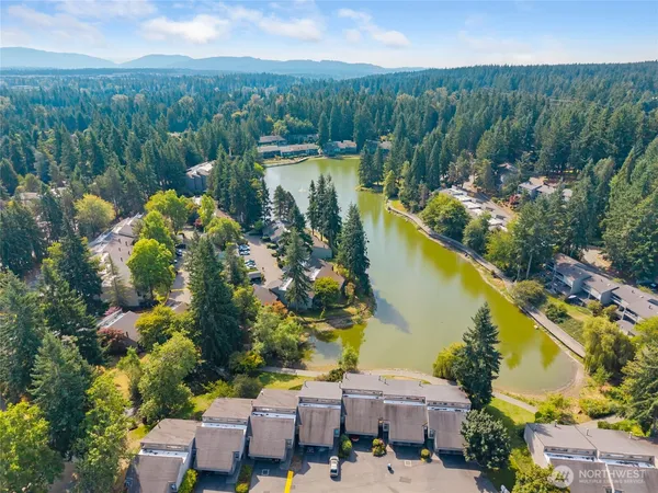 a view of a lake with a house in the background